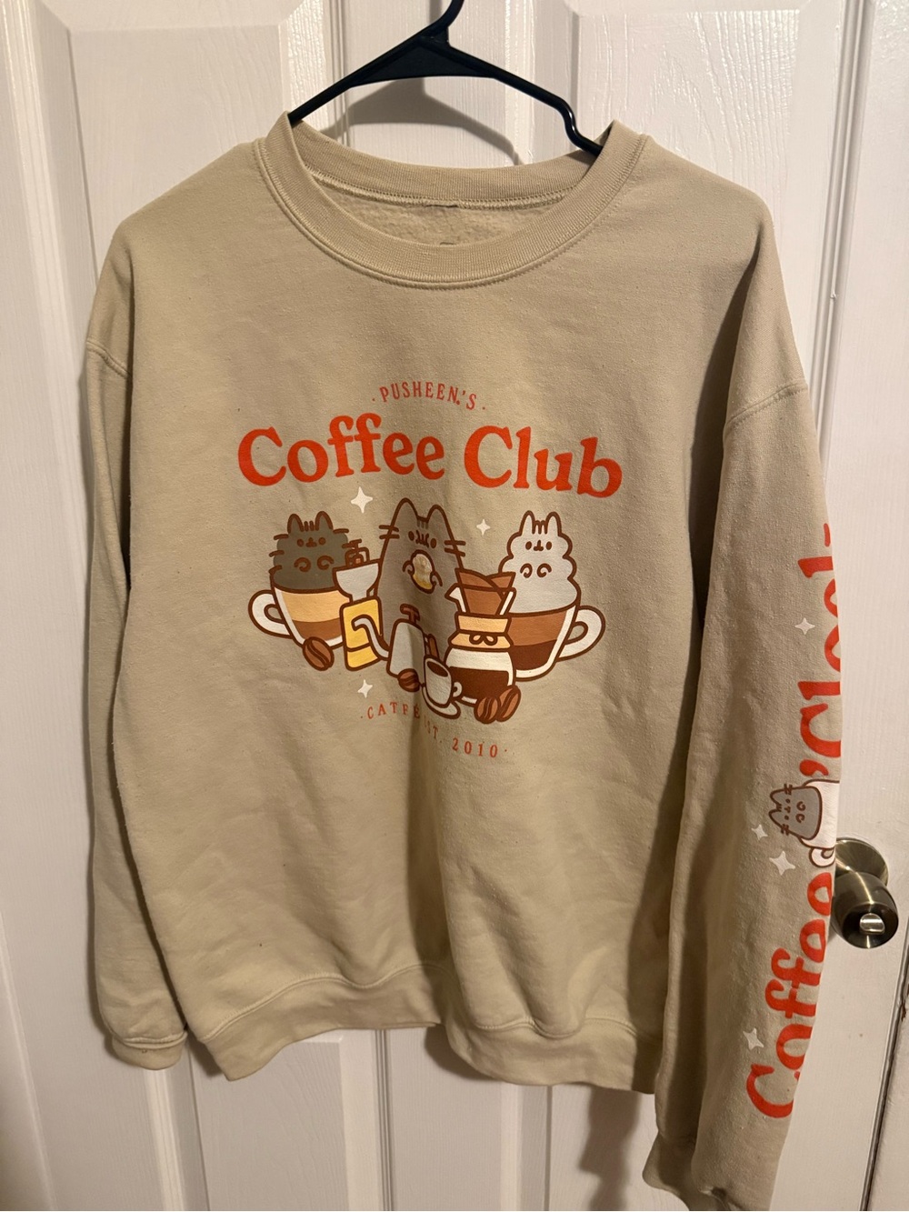 Pusheen Coffee Club Beige Sweatshirt with Orange Graphic